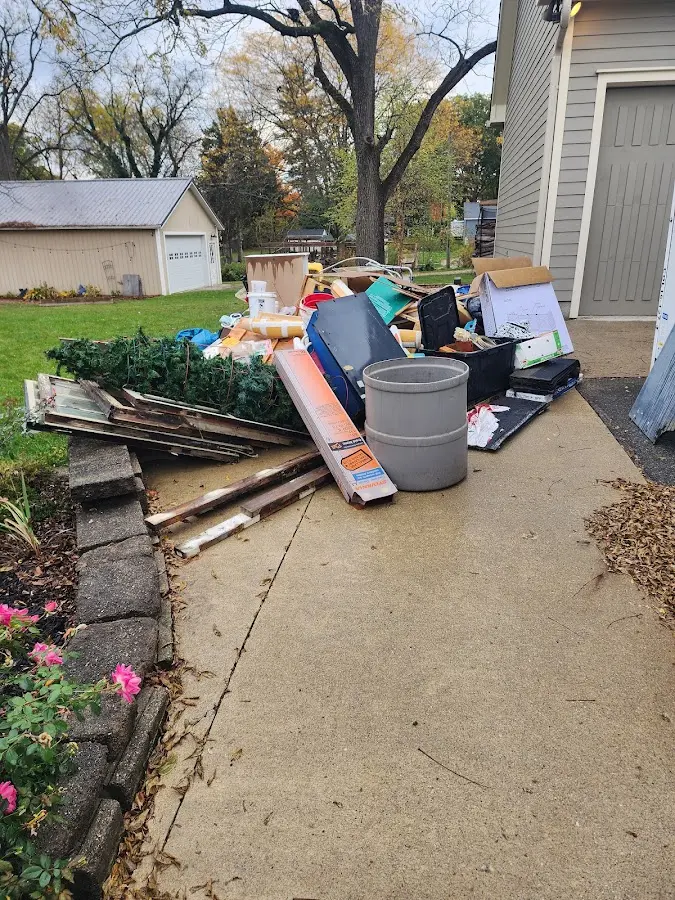 Dumpster being loaded with debris for Commercial Dumpster Rental in Orrington